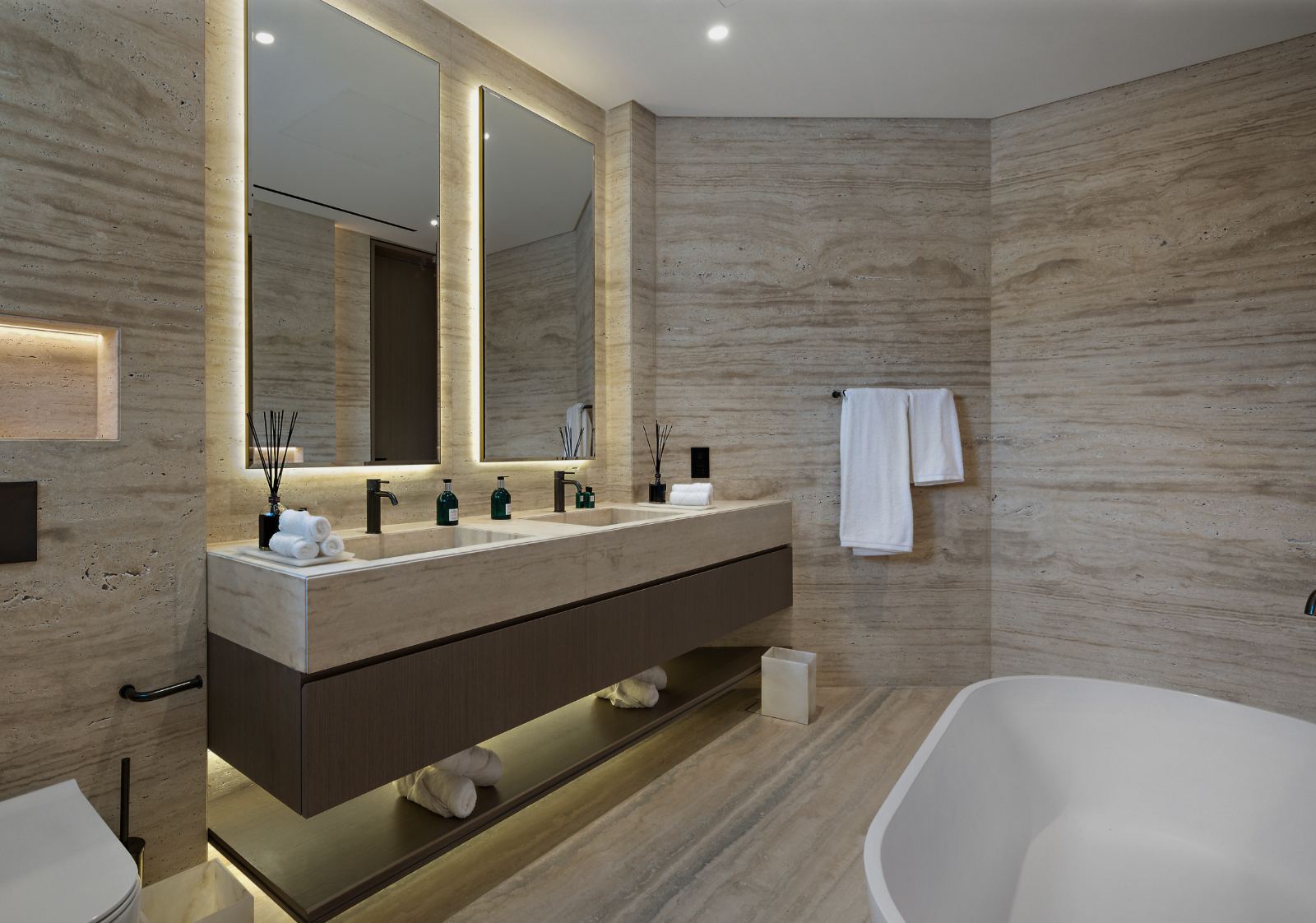 Three finished bathroom vanities across different projects